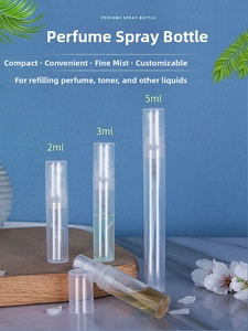 Detailed view of 2ml, 3ml, and 5ml transparent plastic perfume spray bottles on wood