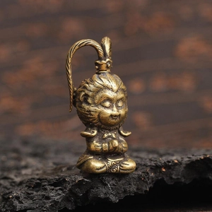 Macro shot of vintage bronze Sun Wukong Buddha statue with detailed Phoenix Feather Cap