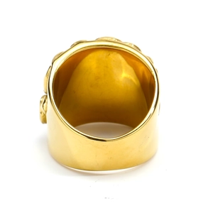 Detailed macro view of the wide golden titanium steel ring showing inner band texture