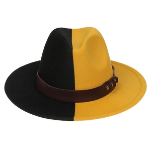 Detail of two-tone black and yellow wool fedora hat with brown studded leather band