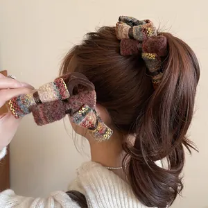 Elegant tweed bow hair claw clip in colorful vintage knit style for autumn and winter