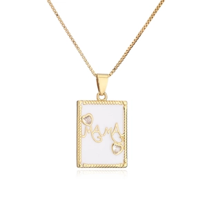 Detailed macro view of 18K gold plated MAMA necklace with zircon heart accents