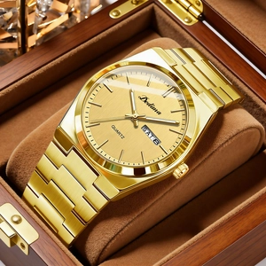Elegant gold quartz watch for men with day-date display and steel strap on a wooden box