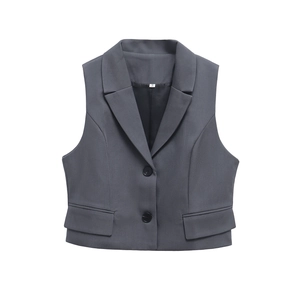 Detailed flat lay of a charcoal grey sleeveless blazer vest with notched lapels and flap pockets