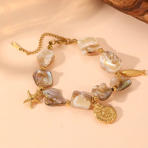 Detailed close-up of shell necklace with golden starfish and seahorse pendants