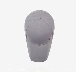 Top down view of grey baseball cap with textured fabric and metallic button detail