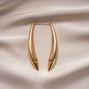 Minimalist 18K gold plated geometric hoop earrings on champagne silk background