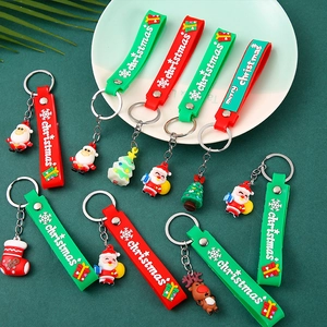 Christmas theme PVC keychains featuring Santa Claus and reindeer on green background