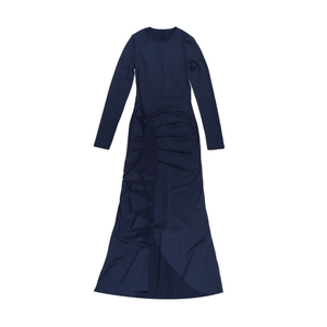 Detail of dark blue long sleeve dress featuring pleated ruffles and asymmetric hemline