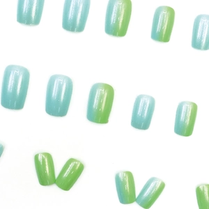 Square blue and green gradient press-on nails with glossy finish on white background
