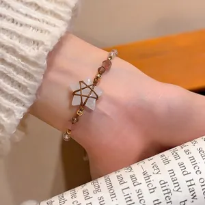 Ethnic star charm bracelet with crystal beads and hand-woven cord for daily wear