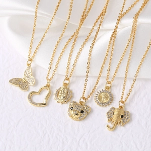Golden pendant necklaces collection featuring butterfly, bear, and elephant motifs