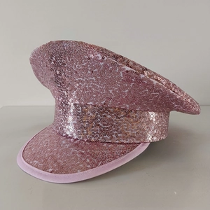 Macro detail of high-density rose gold sequins on a flat-top captain party hat