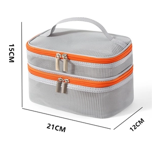 Dual-layer mesh travel toiletry bag in grey with orange zippers and size dimensions