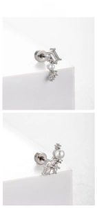 Détail macro du piercing d'oreille argenté avec zircons, perle et fermoir à vis