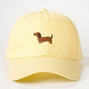 Vintage light yellow baseball cap with brown dachshund embroidery and adjustable strap