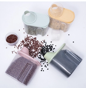 Detailed view of clear plastic food storage containers with colorful lids and pouring spouts