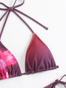 Detail of purple gradient bikini top with floral print and adjustable halter neck ties