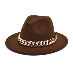 Macro view of dark brown wool fedora hat featuring a chunky gold metal chain link band
