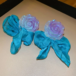 Elegant resin flower and blue bowknot stud earrings with iridescent purple rose details