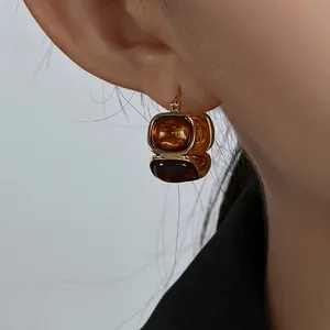 Vintage 18K gold-plated oval resin earrings in amber brown for a retro elegant look