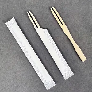 Disposable bamboo fruit forks with heart design and white individual paper packaging