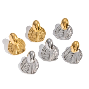 Set of irregular leaf earrings in gold and silver finish with radial textured stripes