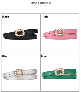 Detailed view of four thin fashion belts with pearl-encrusted buckles in various colors