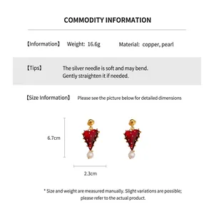 Detailed view of red heart earrings with pearls showing size dimensions and weight