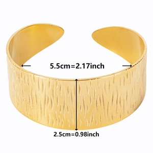 Detailed view of wide gold C-shaped cuff with bark texture and 2.5cm width dimension