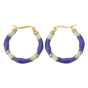 Detail of bohemian bamboo style hoop earrings with blue and green enamel sections