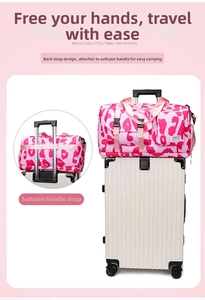 Detail of pink leopard sports travel bag with back strap fixed to a white luggage handle