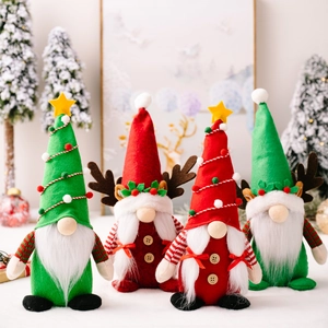 Set of four festive Christmas gnomes with reindeer antlers and star decorations