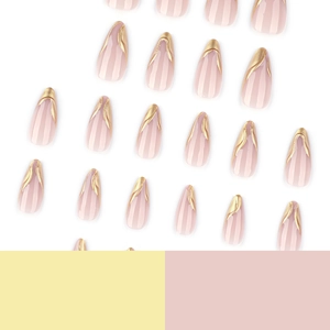 Golden French line almond press on nails in nude pink color on decorative background