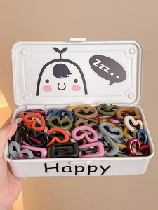Pink heart hair clips in a white metal storage box featuring colorful accessory set