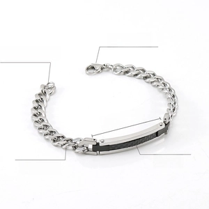 Detailed close-up of 8mm wide stainless steel men's bracelet with black carbon fiber inlay