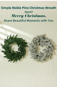 Detail of 40cm PE Noble Fir Christmas wreaths in natural green and flocked snow styles