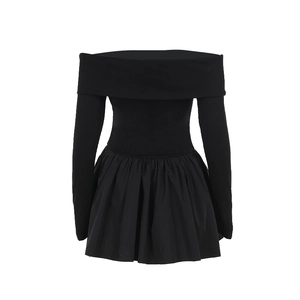 Detail of elegant black off-shoulder dress with long sleeves and pleated skirt hemline