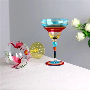 Artistic hand-painted Margarita glass featuring colorful stripes and pink flamingo designs