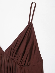 Close-up of spaghetti straps and pleated neckline on dark brown tiered maxi dress