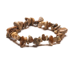 Detailed close-up of natural irregular jasper stone beads on a handmade bracelet