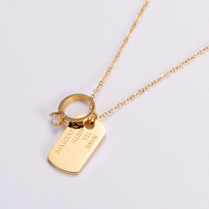 18K gold plated necklace with custom engraved bar and zircon ring pendant on light background