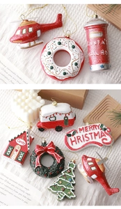 Festive Christmas resin ornaments including mailbox and donut with golden strings