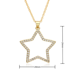 Detail view of gold star pendant with micro-paved zircons measuring 29mm by 29mm