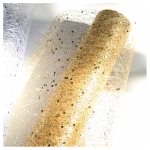 Detail of champagne gold mesh ribbon with sequins and glitter for Christmas decoration