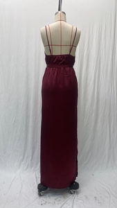 Detail of burgundy satin dress showing backless design and high-quality fabric texture