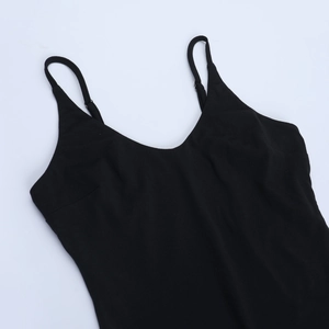 Detailed close-up of V-neckline and adjustable spaghetti straps on a black bodysuit