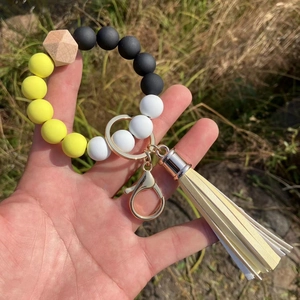 Handheld silicone bead bracelet keychain with leopard prints, yellow tassel and metal clasp