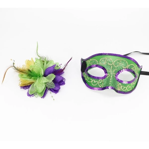 Detail of green sequin masquerade mask with purple flowers and feathered headpiece