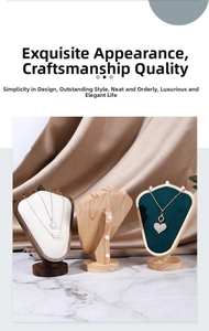 Three premium necklace display stands in wood, white leather, and dark green velvet set